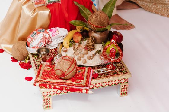 Low table set with coconut, kalash and offerings
