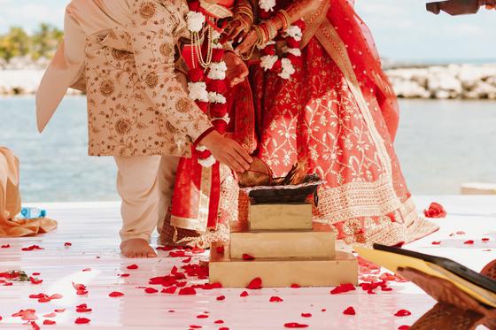 Taking the seven steps across the petal-strewn platform
