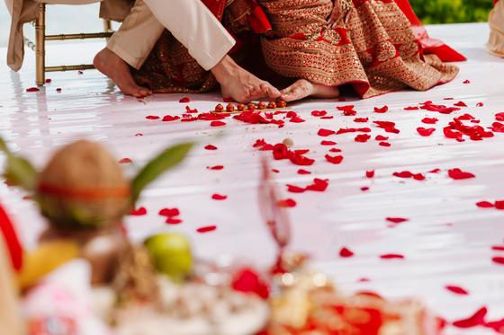 Rose petals scattered across the ceremony platform