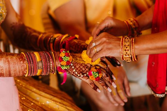 Close detail of bridal henna and stacked bangles