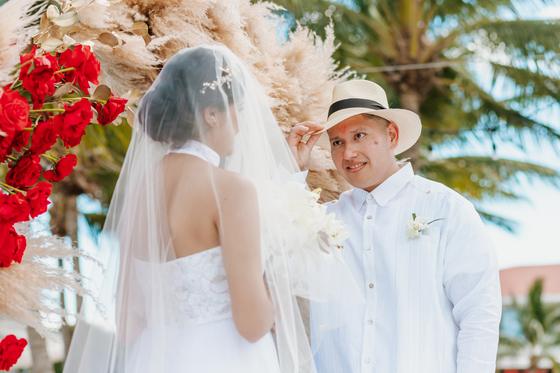 Couple facing each other at the altar