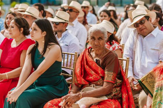 Guests seated in the shade during the ceremony