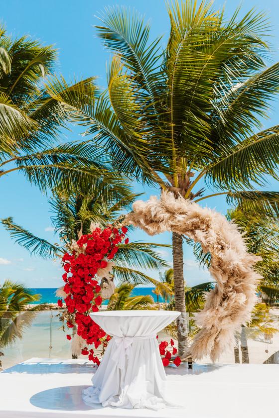 Pampas grass and red bougainvillea arch on the beach