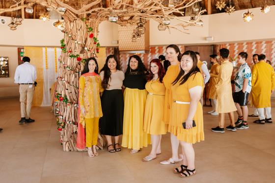 Wedding guests gathered in yellow for the haldi