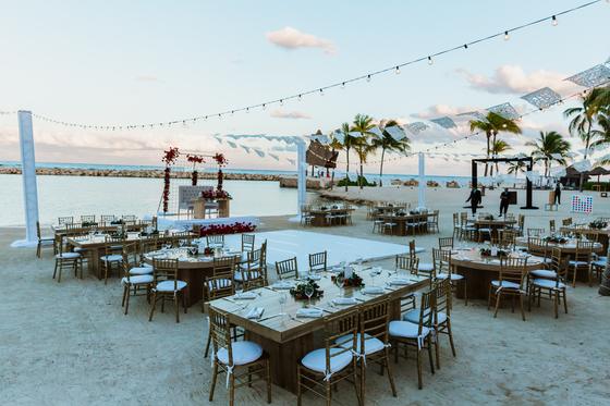 Reception set on the beach with the sea behind