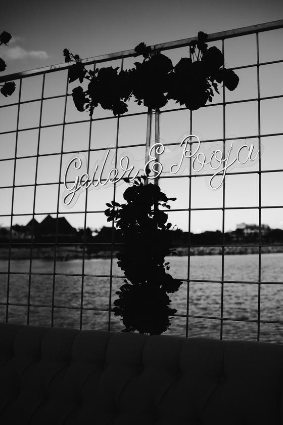 Black and white silhouette of the reception backdrop at dusk