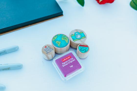 Painted guest-book stones and markers on a table