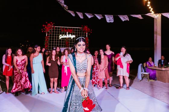Bride entering the reception in a teal lehenga