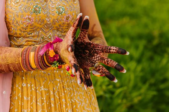 Open palms covered in fresh bridal mehndi