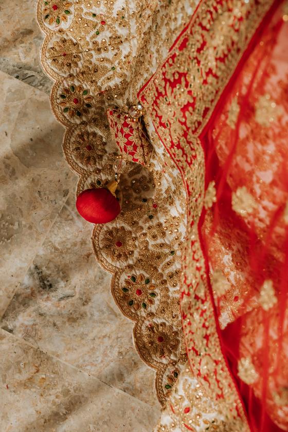 Gold and red embroidery of the bridal lehenga