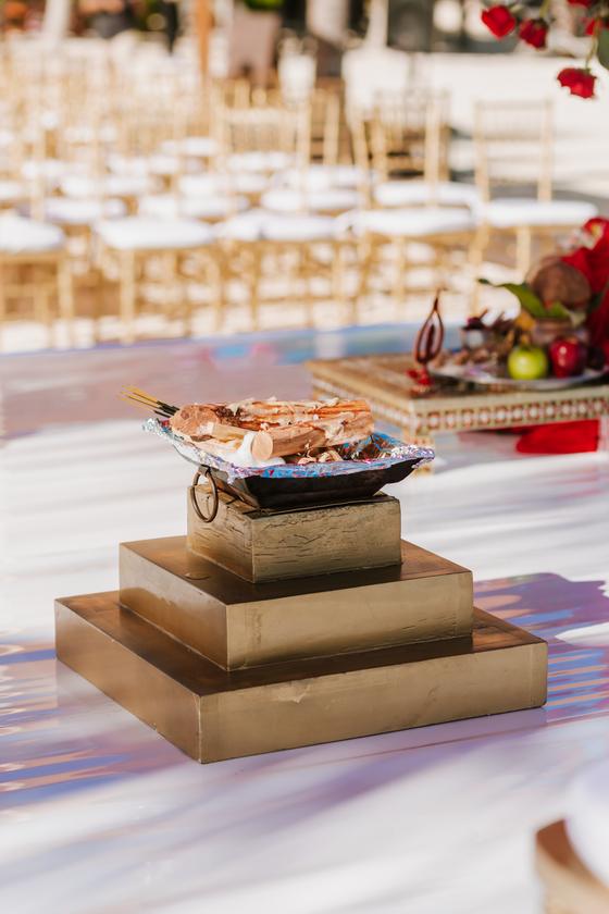 Havan kund and ritual vessels set on the mandap platform