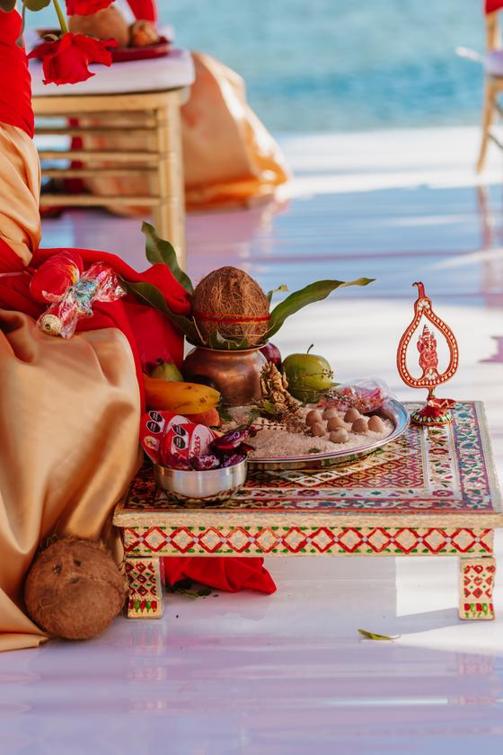 Puja items arranged on the platform above the water