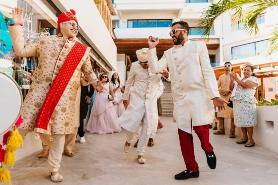 Baraat procession moving through the resort walkway