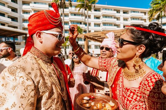 Couple meeting at the end of the baraat procession