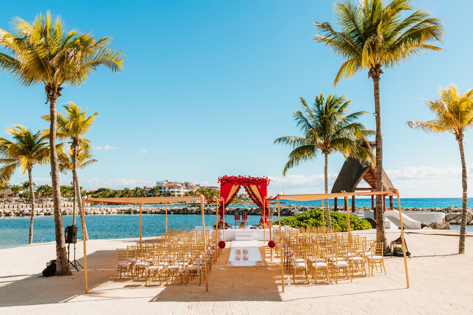 The mandap and rows of chairs set on the beach for the Hindu ceremony