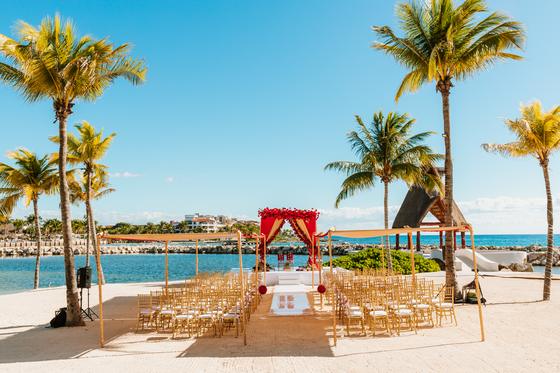 Beachfront ceremony set for the Hindu wedding, chairs in rows